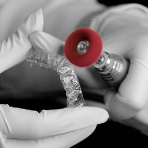 close up of a dental technician making an invisalign