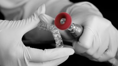 close up of a dental technician making an invisalign